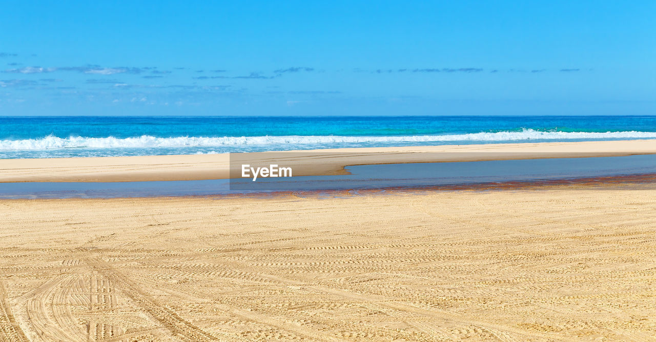 SCENIC VIEW OF SEA AGAINST BLUE SKY