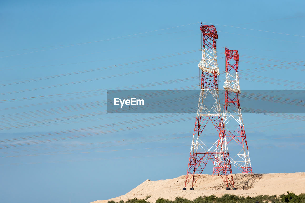 LOW ANGLE VIEW OF TELEPHONE POLE AGAINST SKY