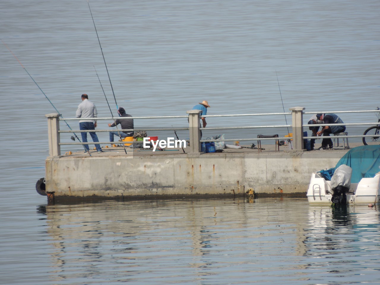 PEOPLE FISHING IN SEA