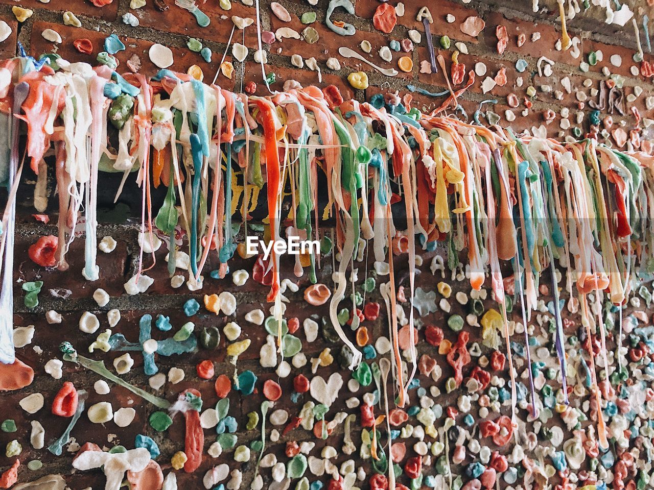 Full frame shot of multi colored bubble gum on wall