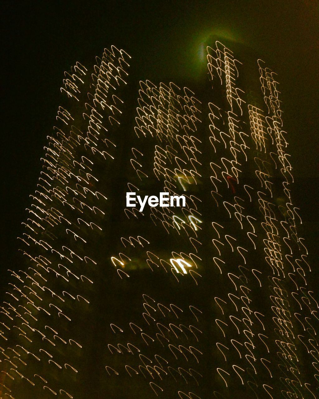 LOW ANGLE VIEW OF ILLUMINATED BUILDINGS