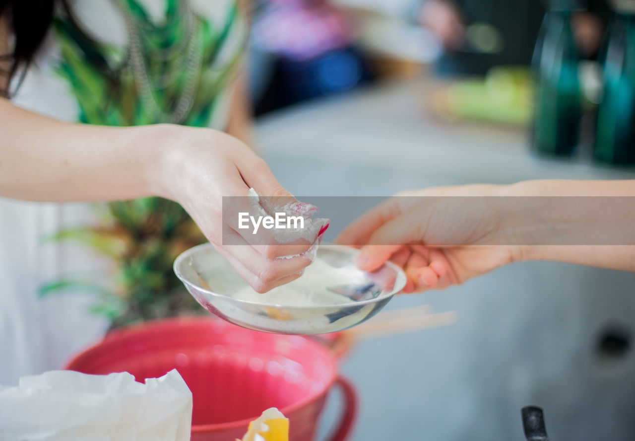 Close-up of hands preparing food