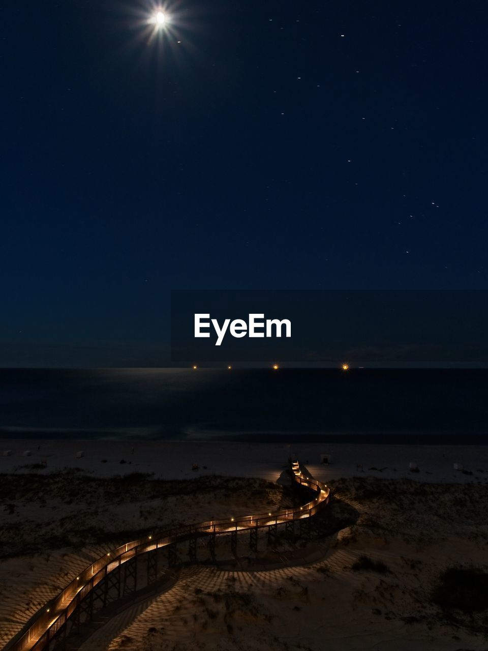 Scenic view of sea against sky at night