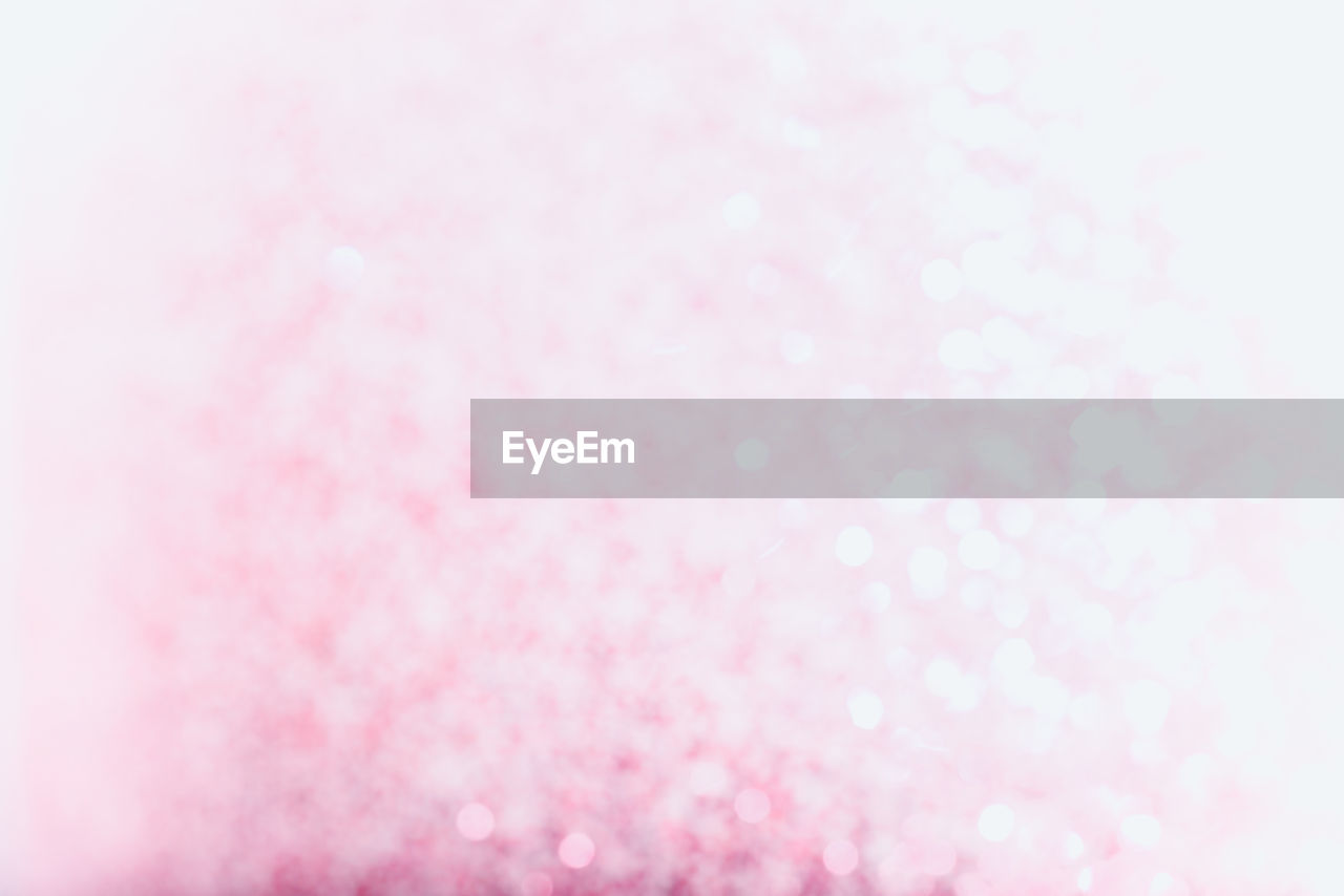 Defocused image of pink glitters