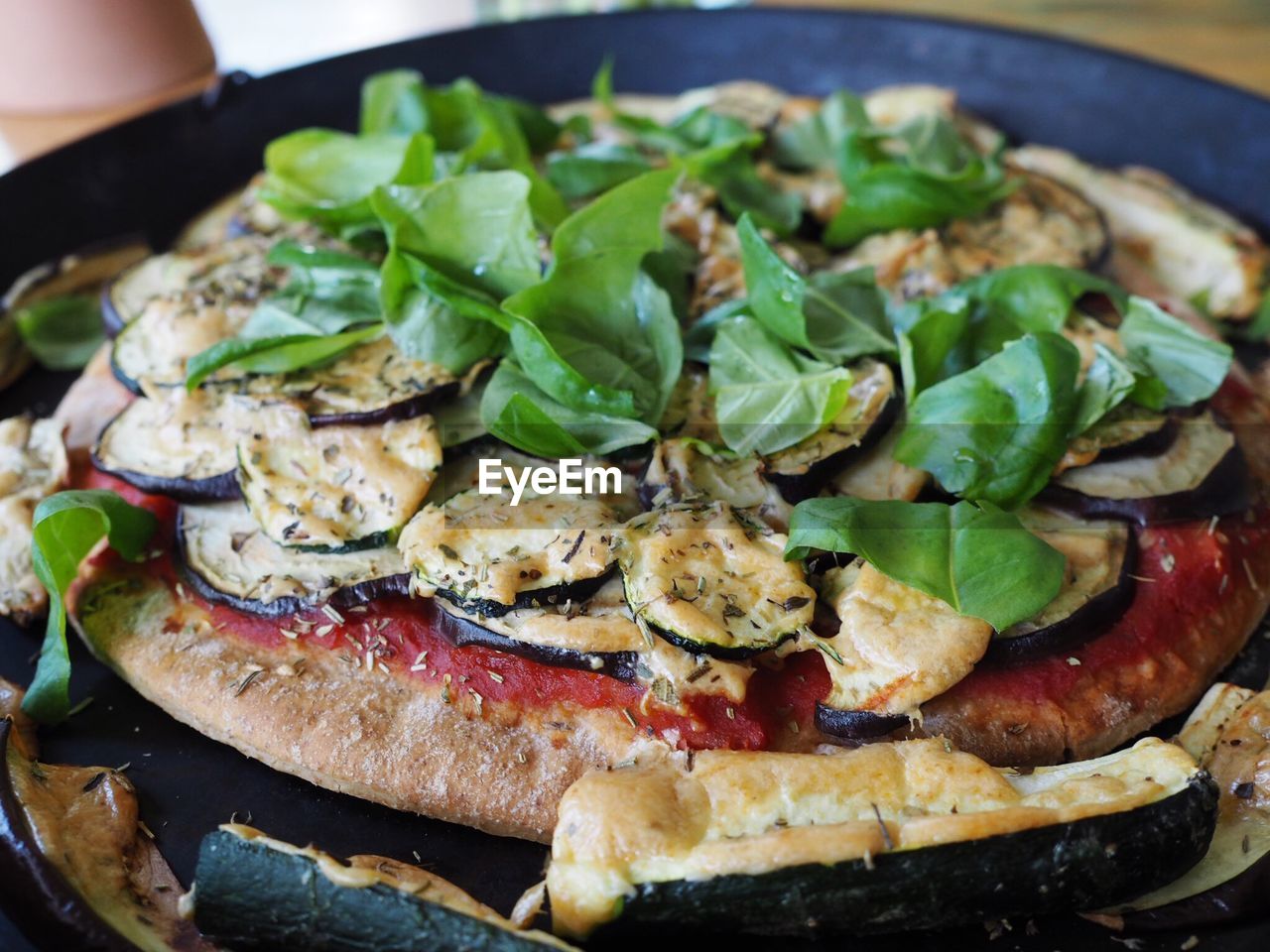 High angle view of fresh pizza served in hot pan