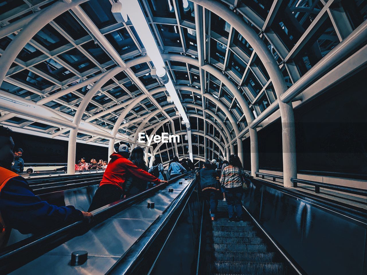 Low angle view of people standing in elevator