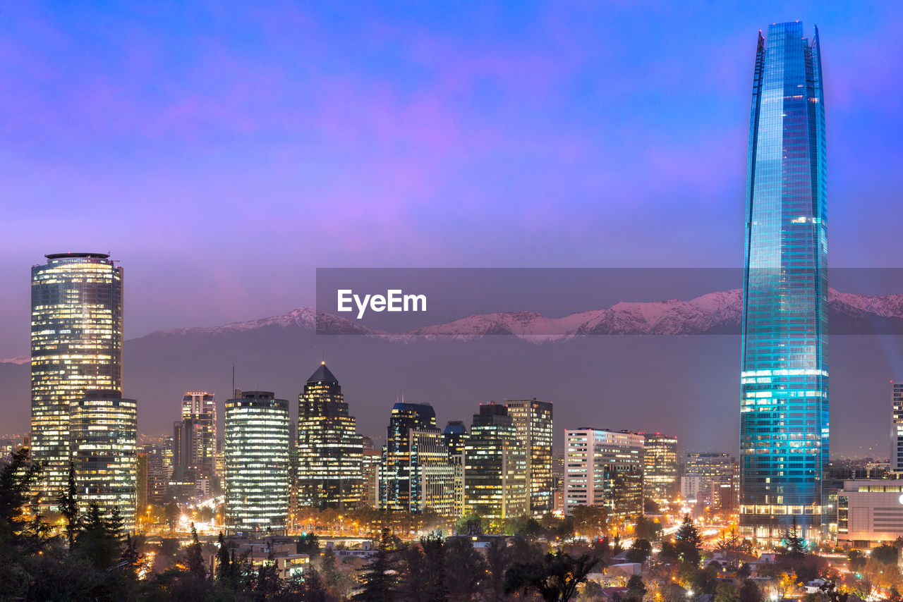 Financial district skyline with los andes mountains in the back, las condes, santiago de chile