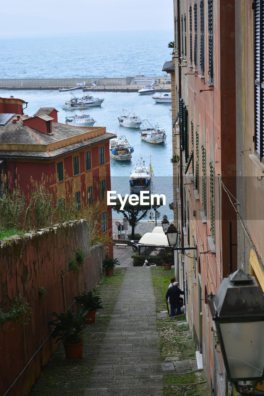 HIGH ANGLE VIEW OF BUILDINGS BY SEA