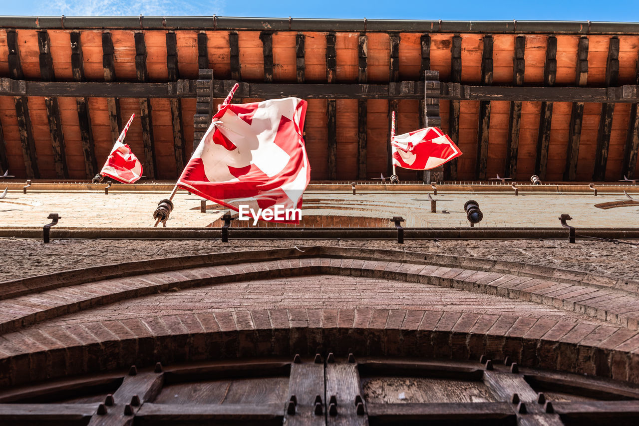 RED FLAGS ON BRIDGE OVER CANAL