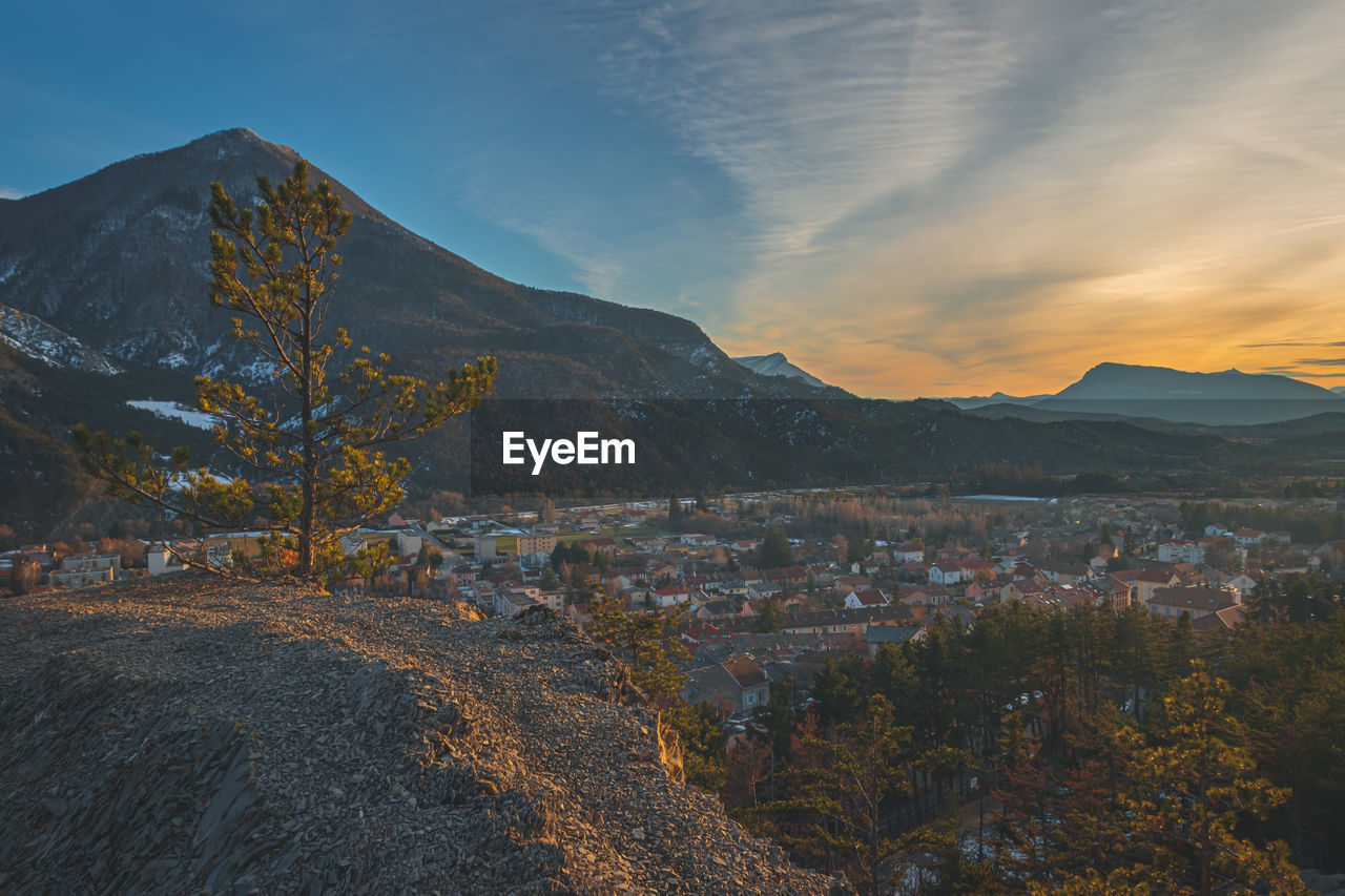 A panoramic wide landscape view of veynes, an old town in the french alps, during the sunset