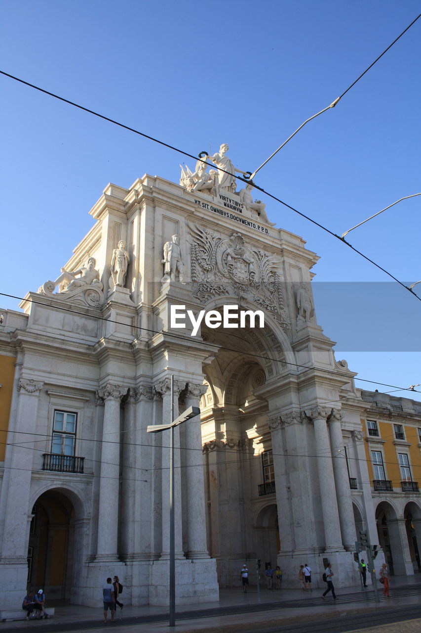 Low angle view of historical building against blue sky