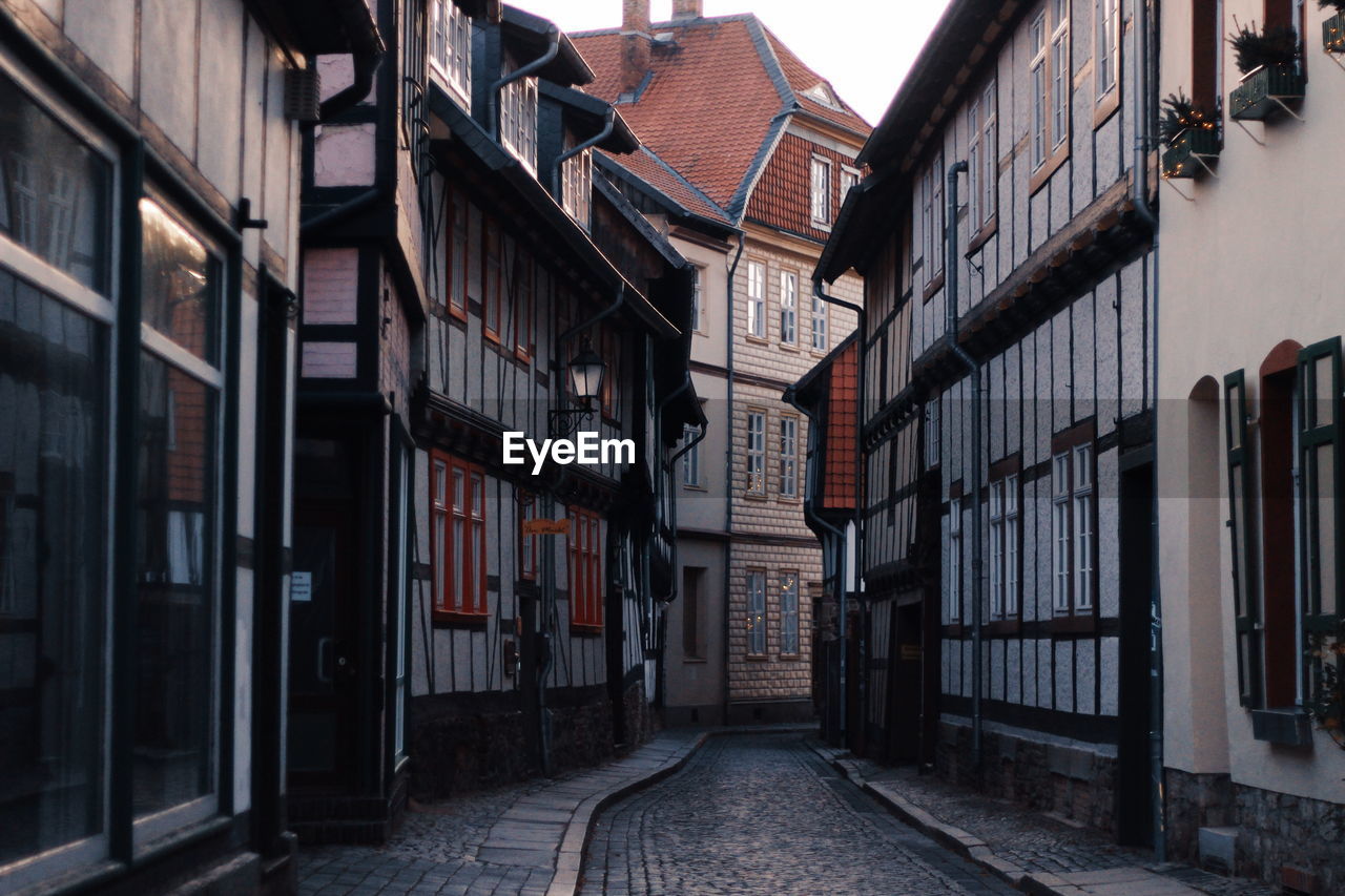 Narrow alley amidst buildings in city