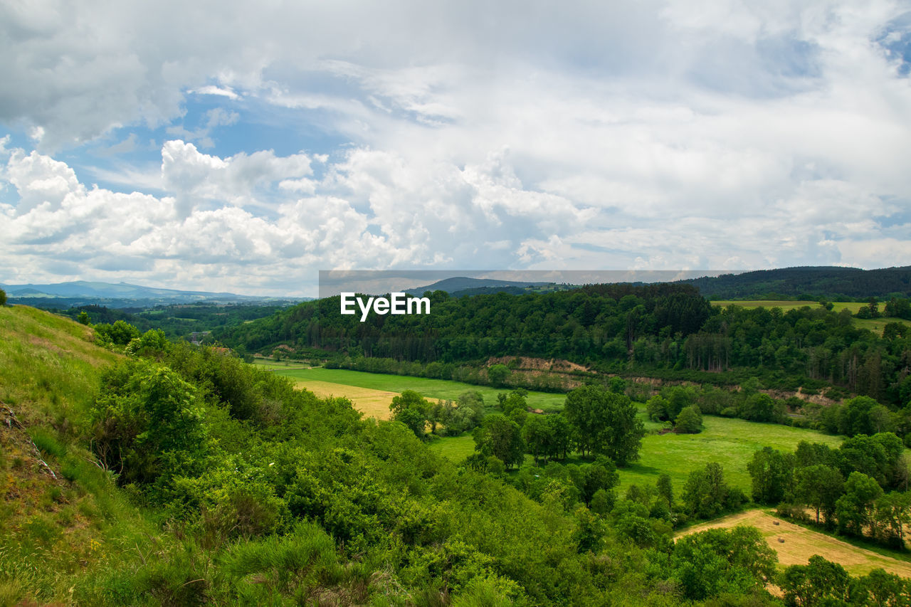 View of the chain of auvergne volcanoes under a thunderstorm