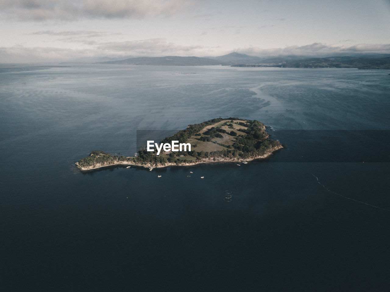 High angle view of island in sea against sky