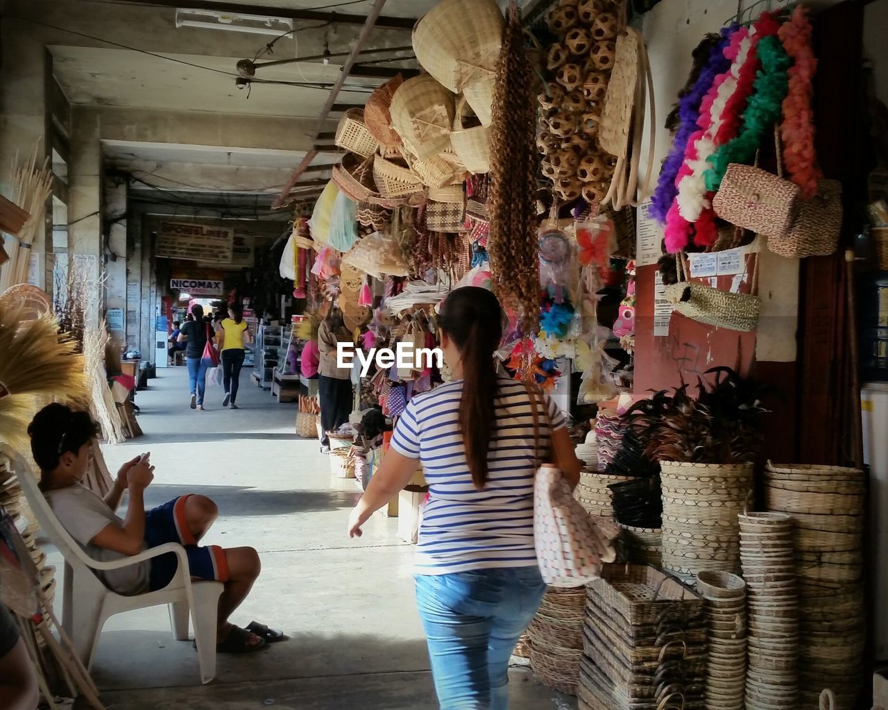 PEOPLE AT MARKET STALL