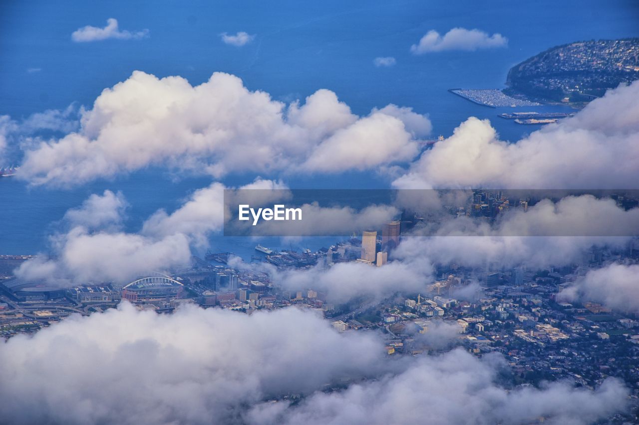 Seattle oregon aerial views from airplane. cloud cover, sea ocean and city views.