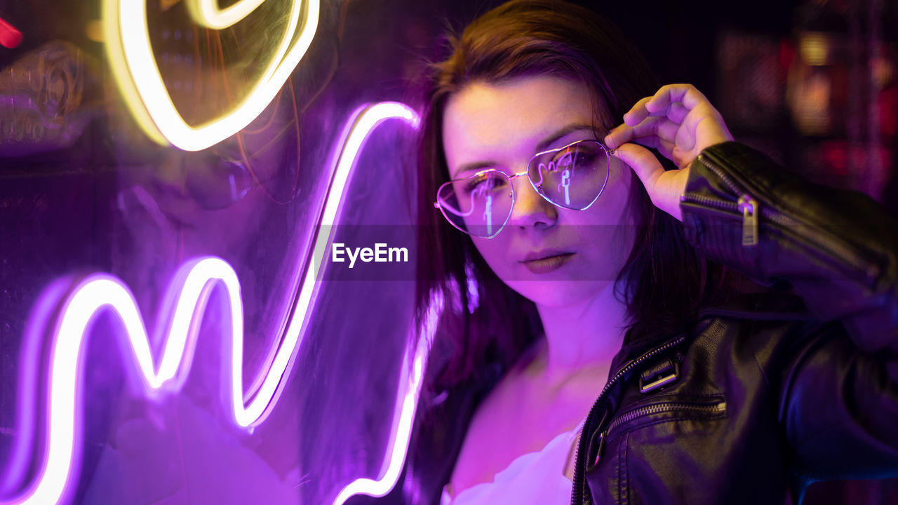 Portrait of young woman wearing sunglasses