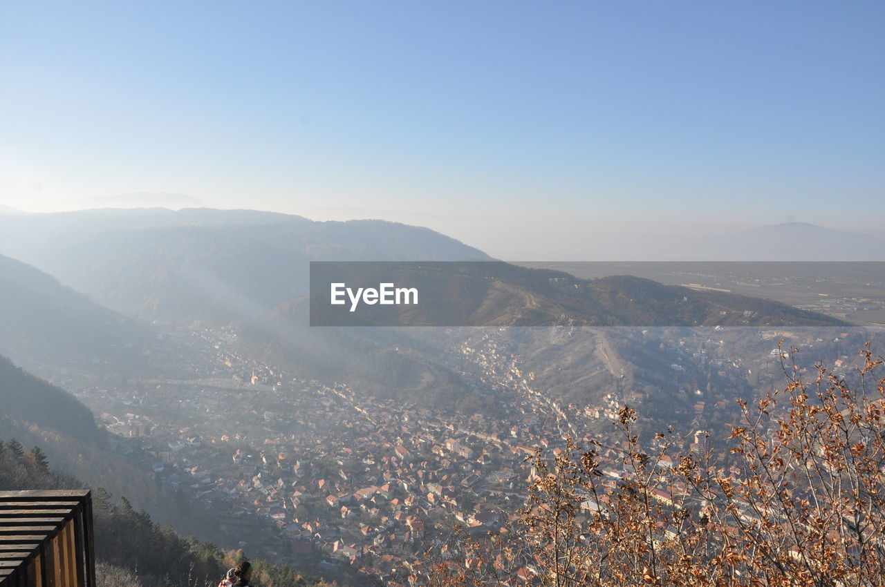 AERIAL VIEW OF MOUNTAINS AGAINST SKY