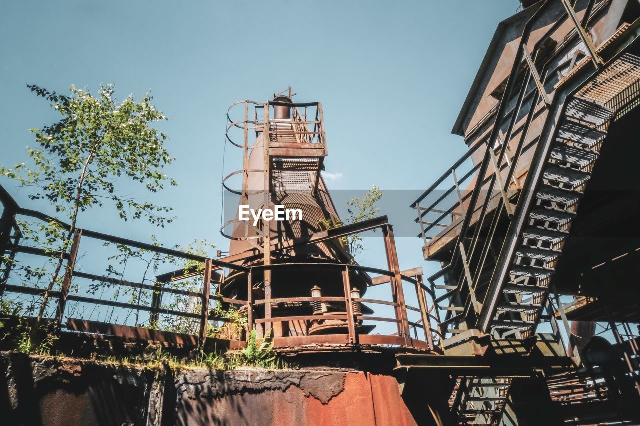 Low angle view of construction site against sky