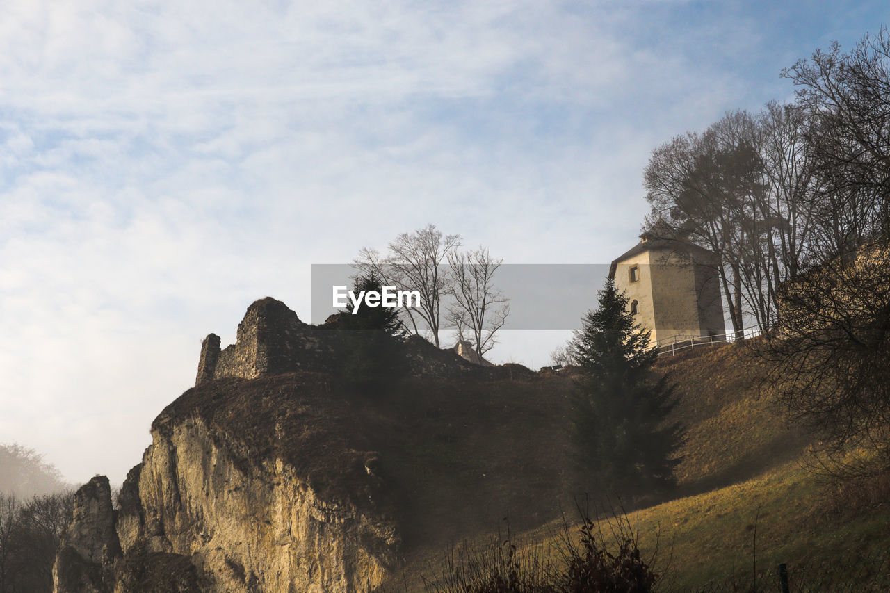 Low angle view of ojcow castle against sky