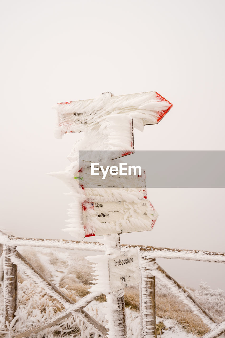 Aerial view of snow covered landscape against clear sky