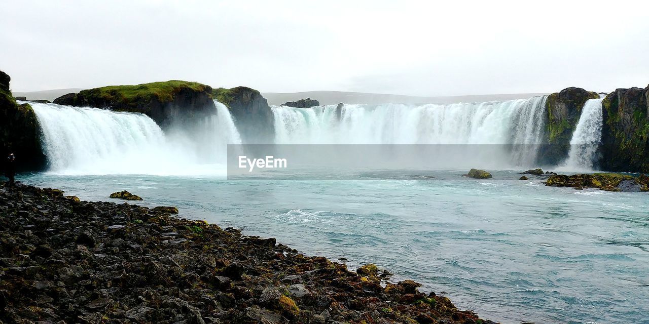 SCENIC VIEW OF WATERFALL IN SKY