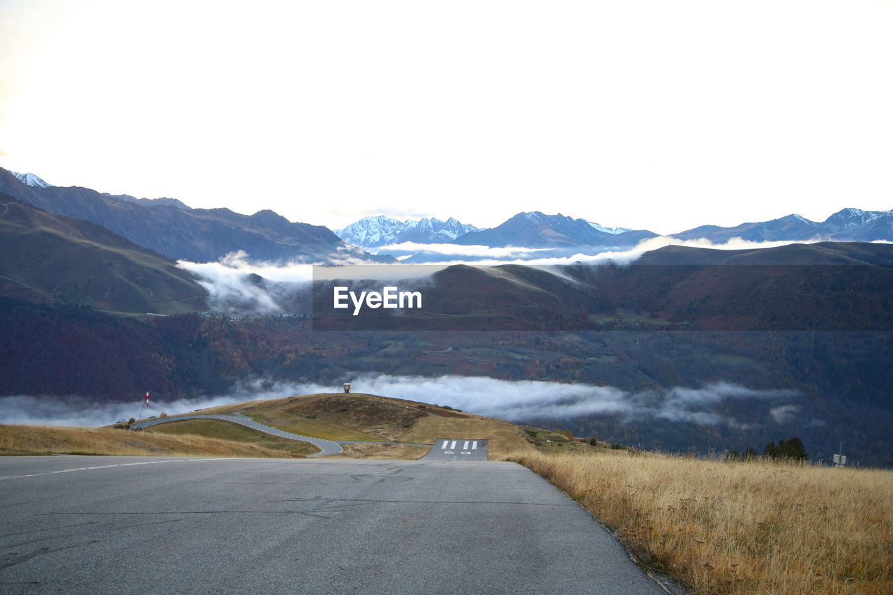 road by mountains against clear sky