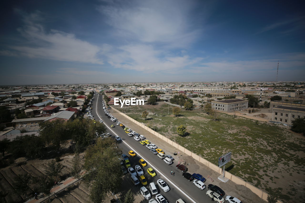 High angle view of vehicles on road against sky