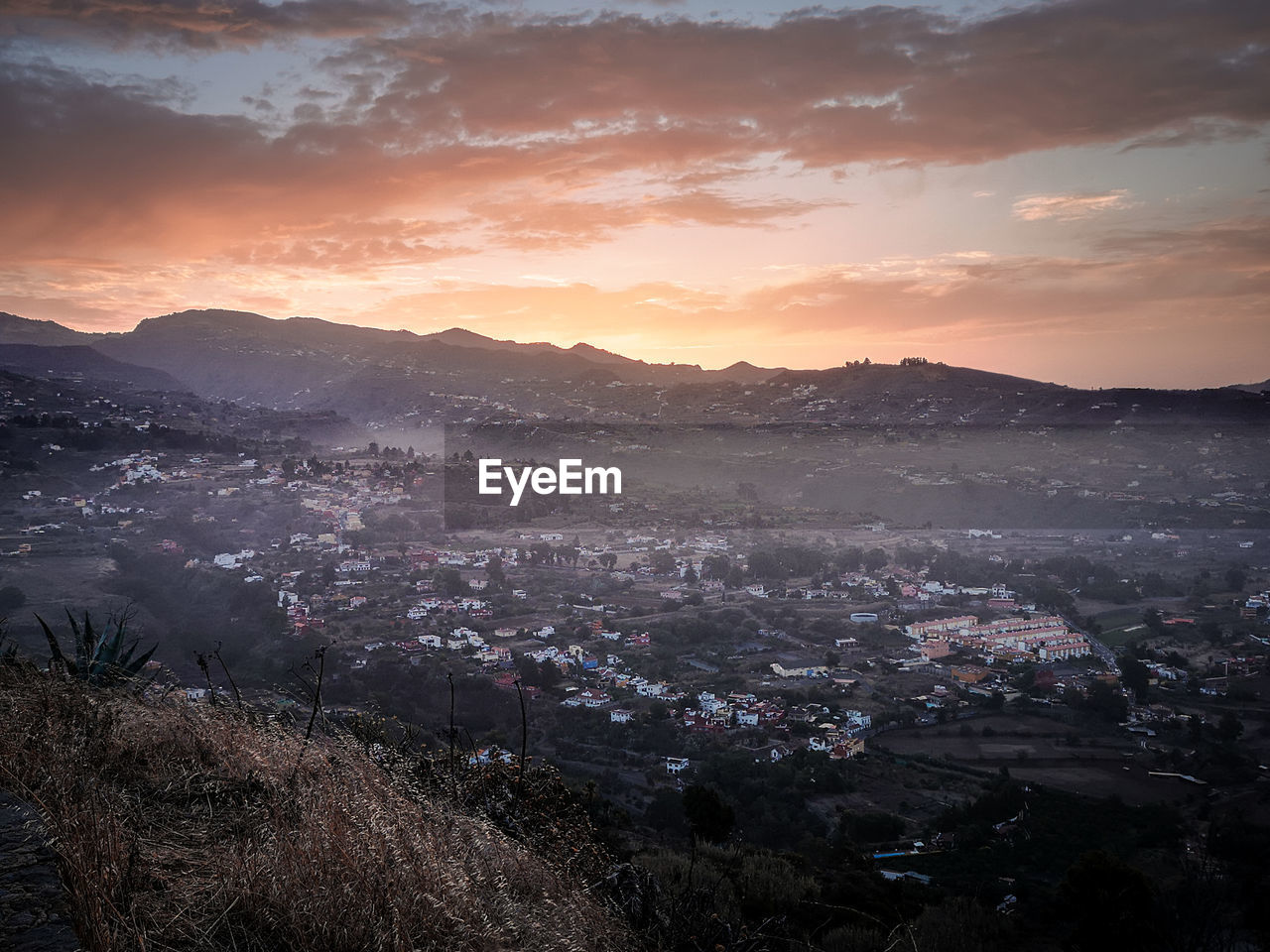 High angle view of townscape against sky during sunset