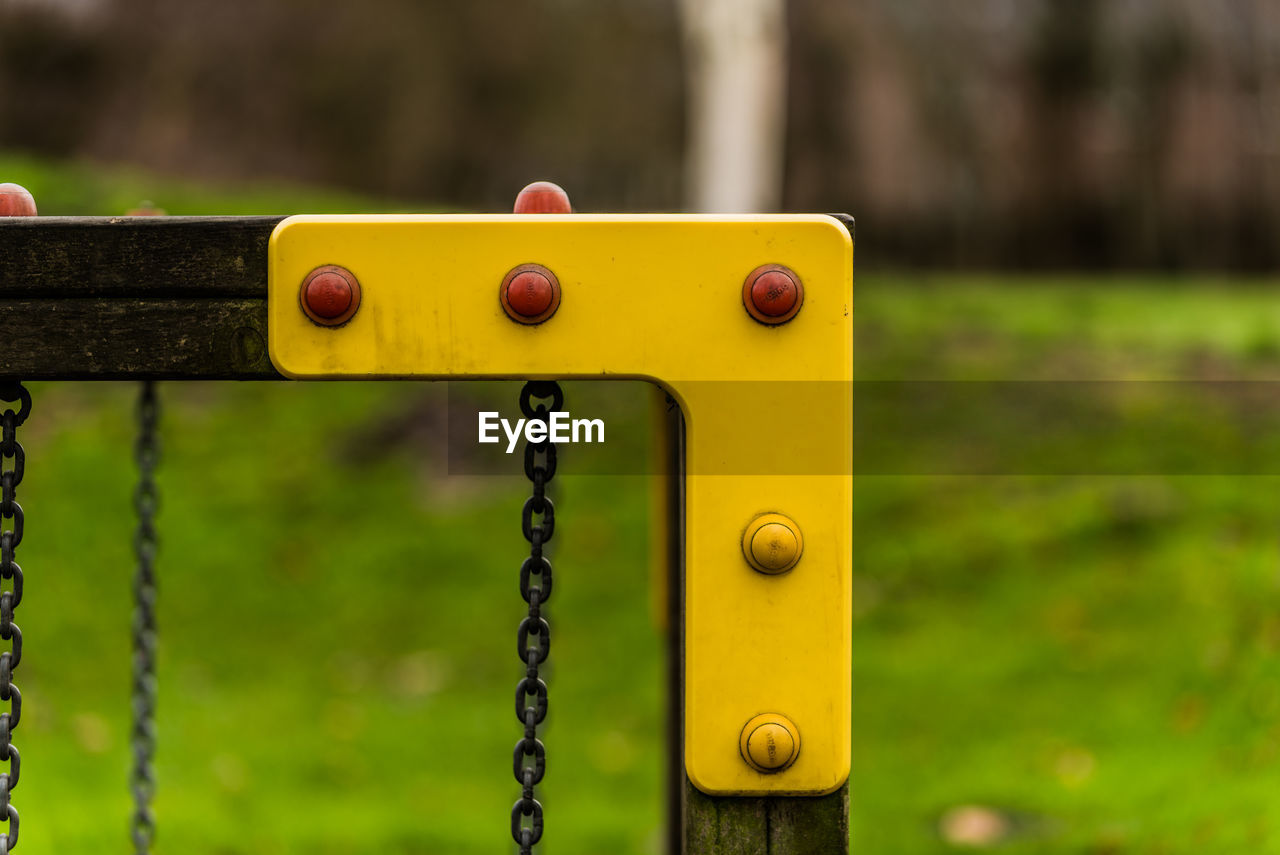 Close-up of rusty metal chain in playground