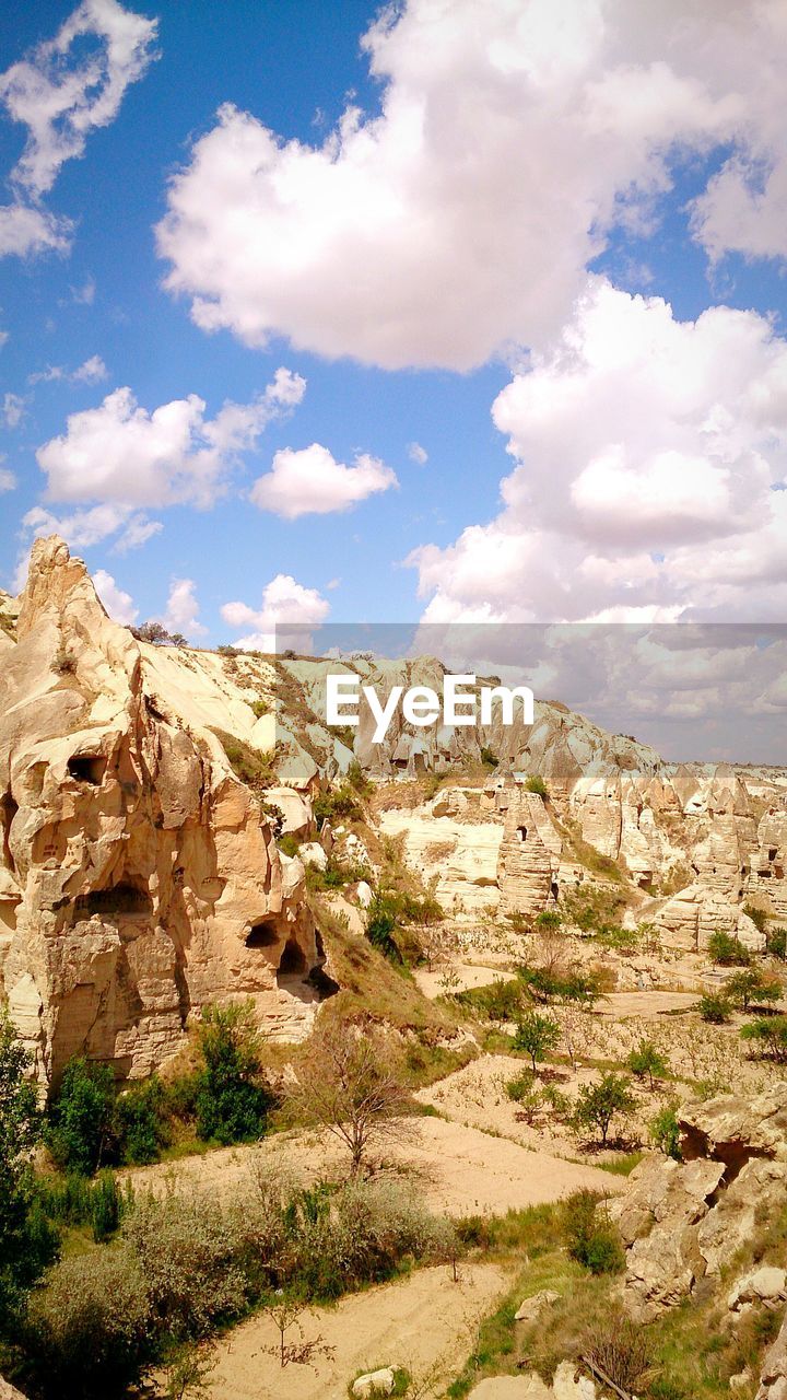 Scenic view of cliff against sky