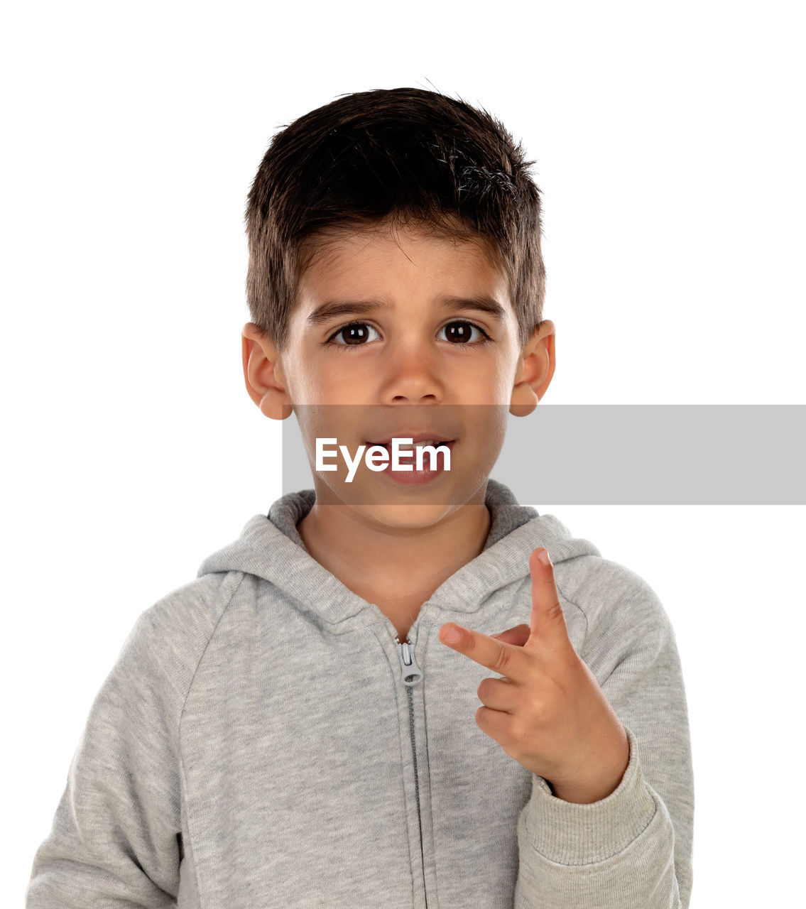 PORTRAIT OF CUTE BOY AGAINST GRAY BACKGROUND