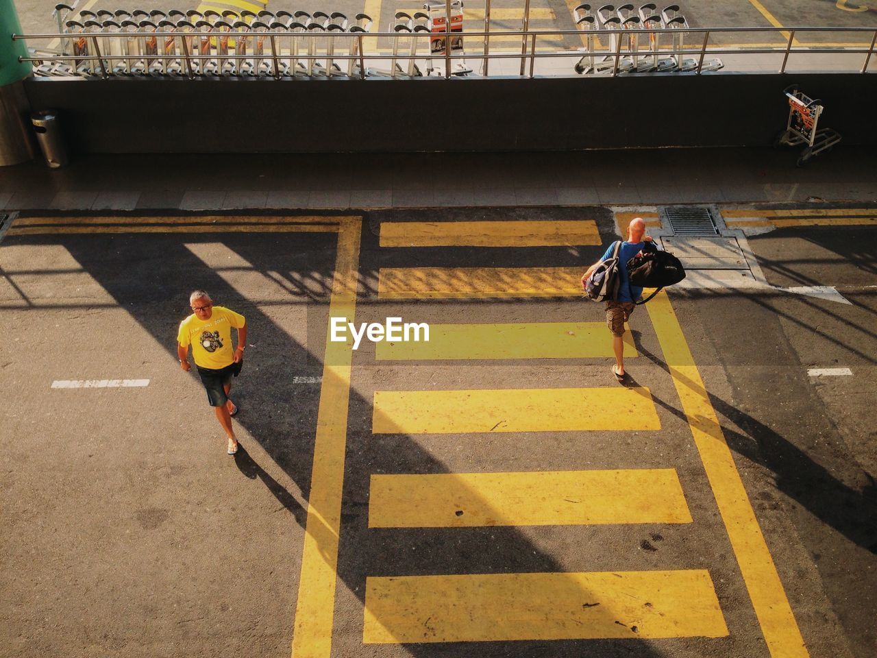 High angle view of men crossing road