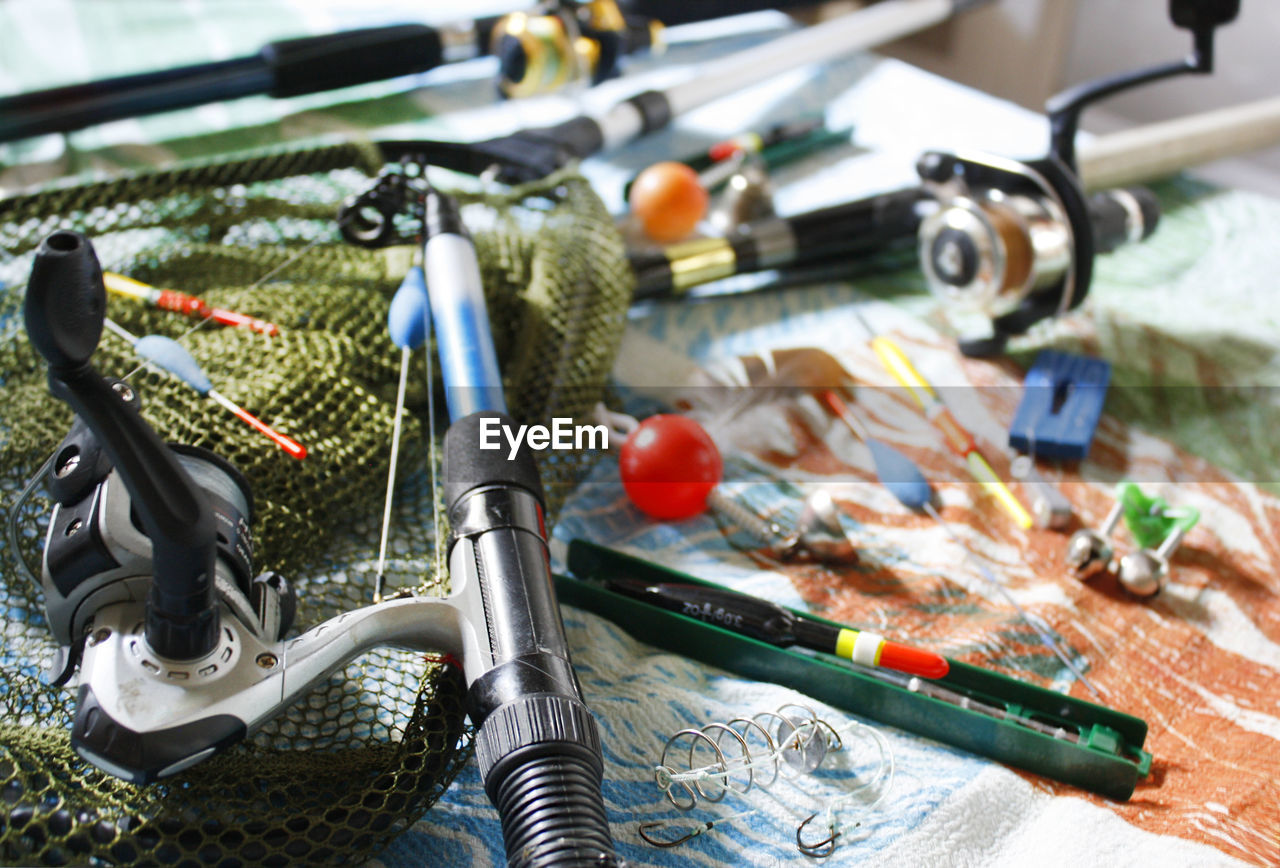 High angle view of fishing rods on table