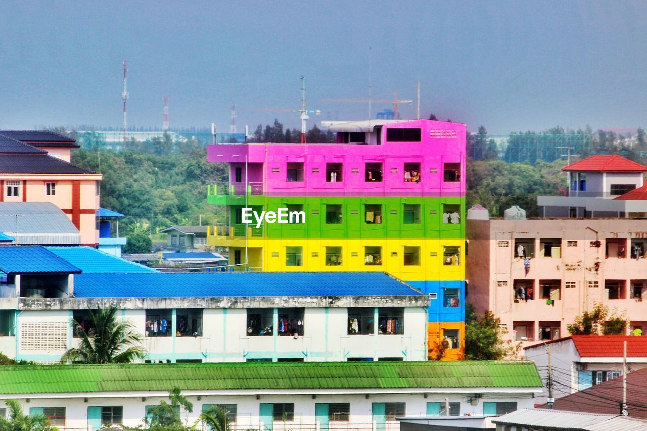 Buildings against clear sky on sunny day