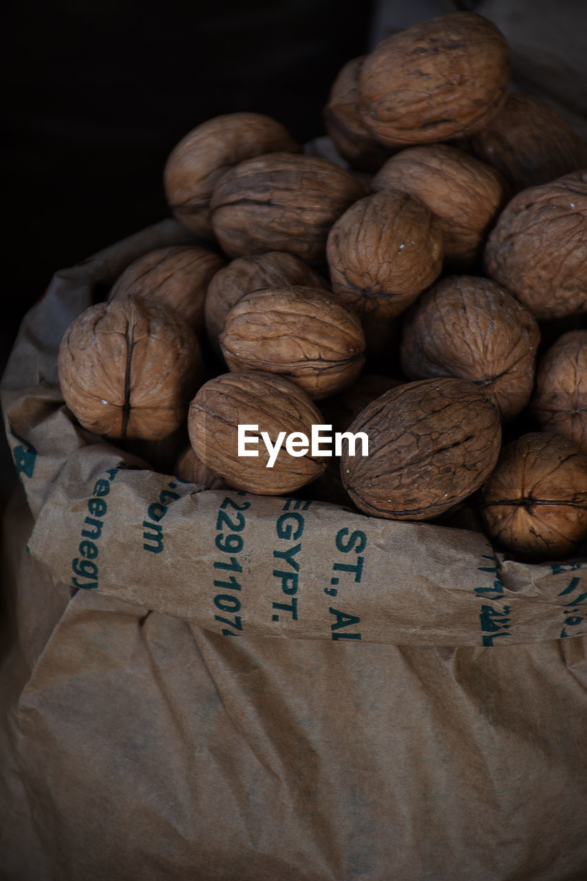 High angle view of walnuts in paper bag