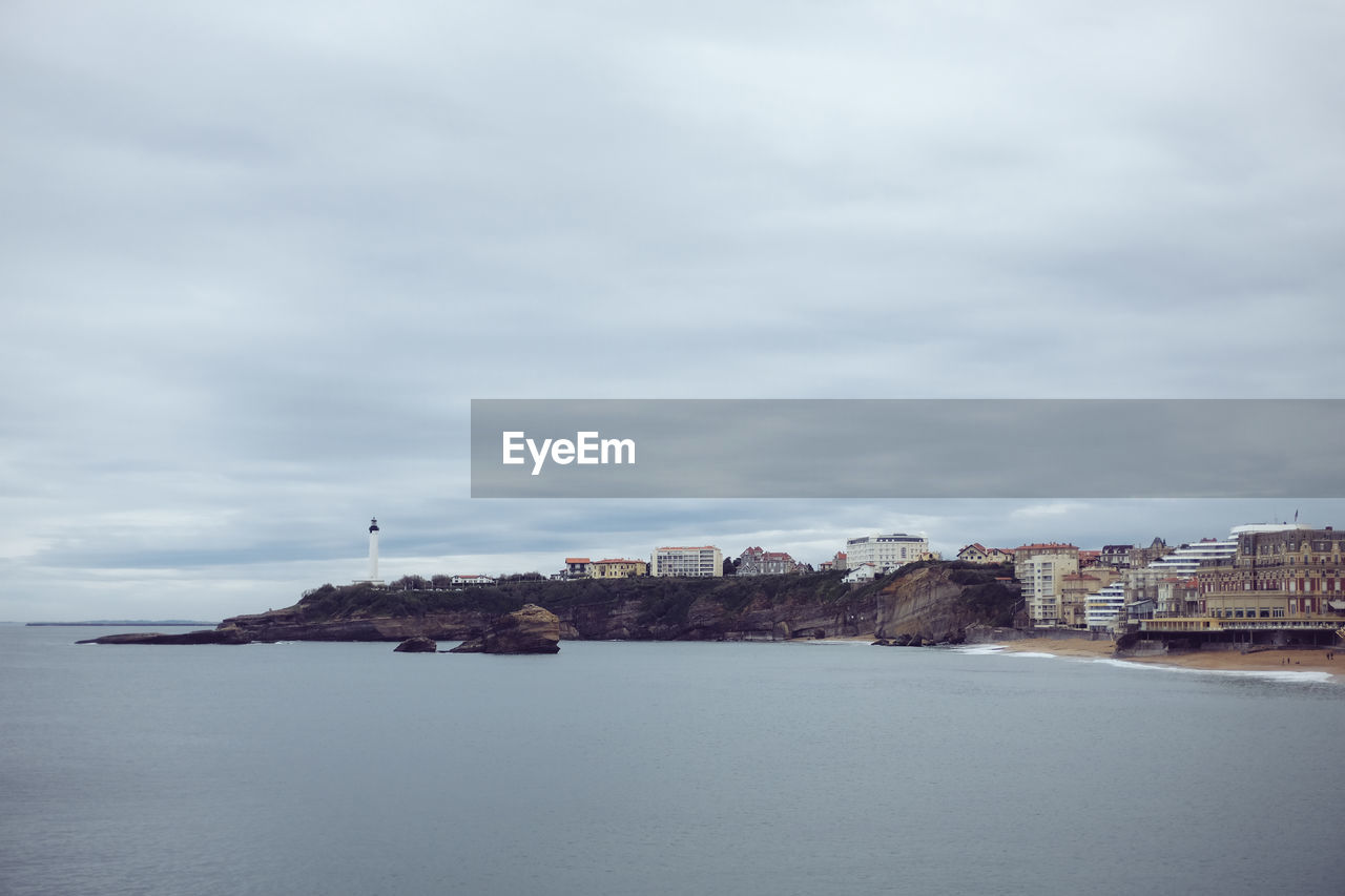 Scenic view of sea against cloudy sky