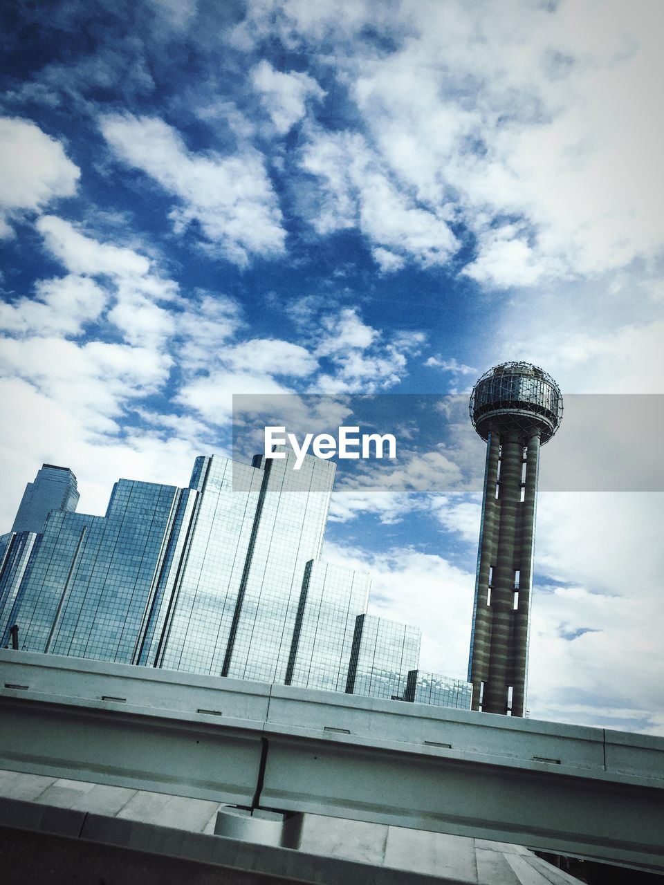 Low angle view of communications tower against sky