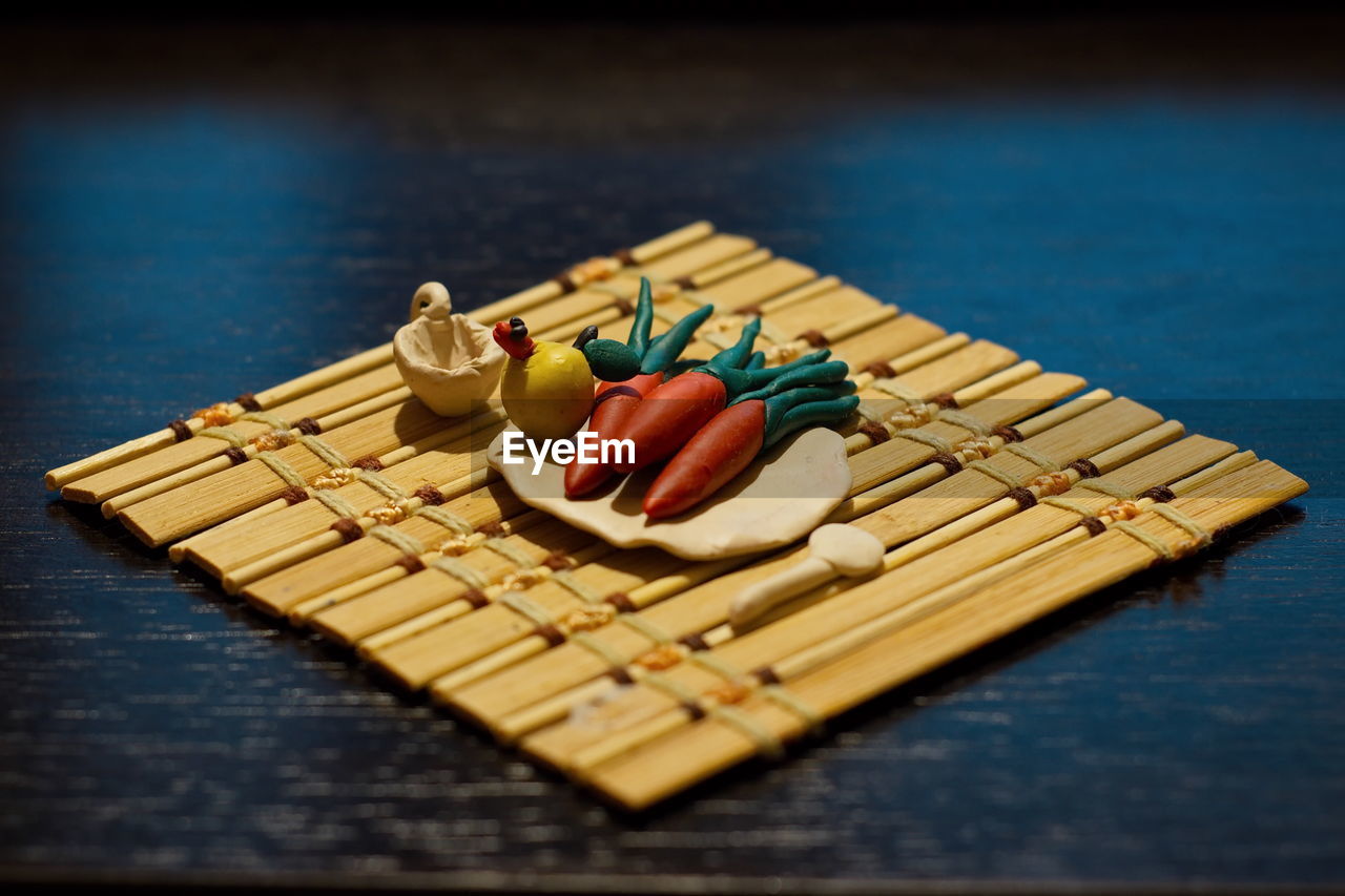 HIGH ANGLE VIEW OF WOODEN TABLE