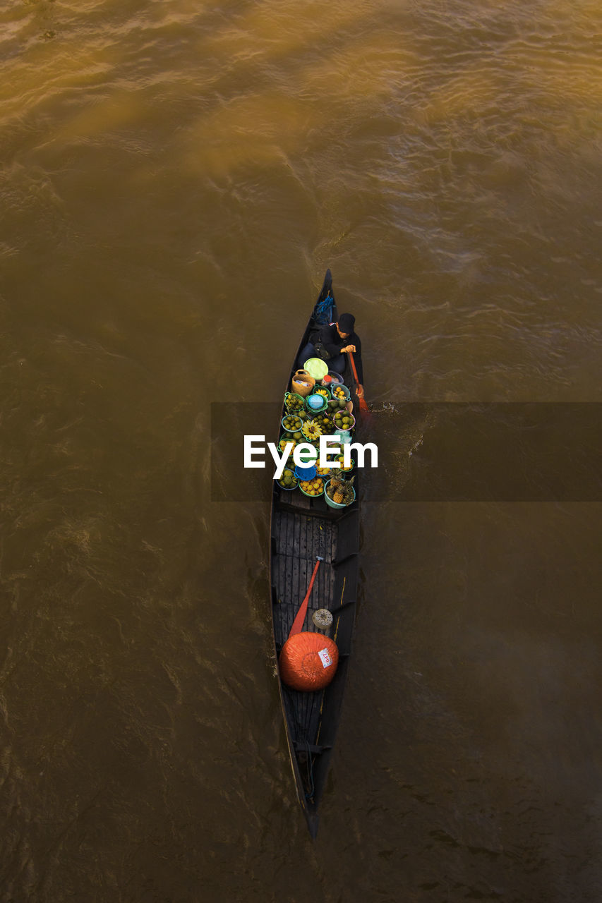 High angle view of man in boat on river