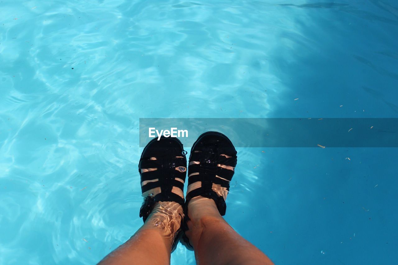 Low section of woman in swimming pool