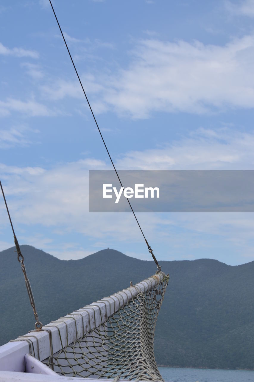 Low angle view of ski lift against sky