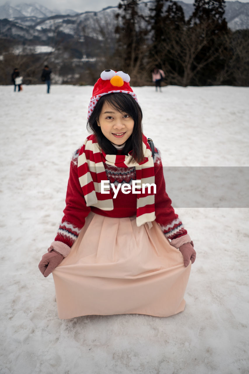 Portrait of young woman on snow