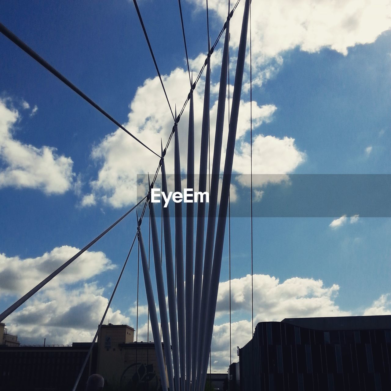 Low angle view of cables against sky