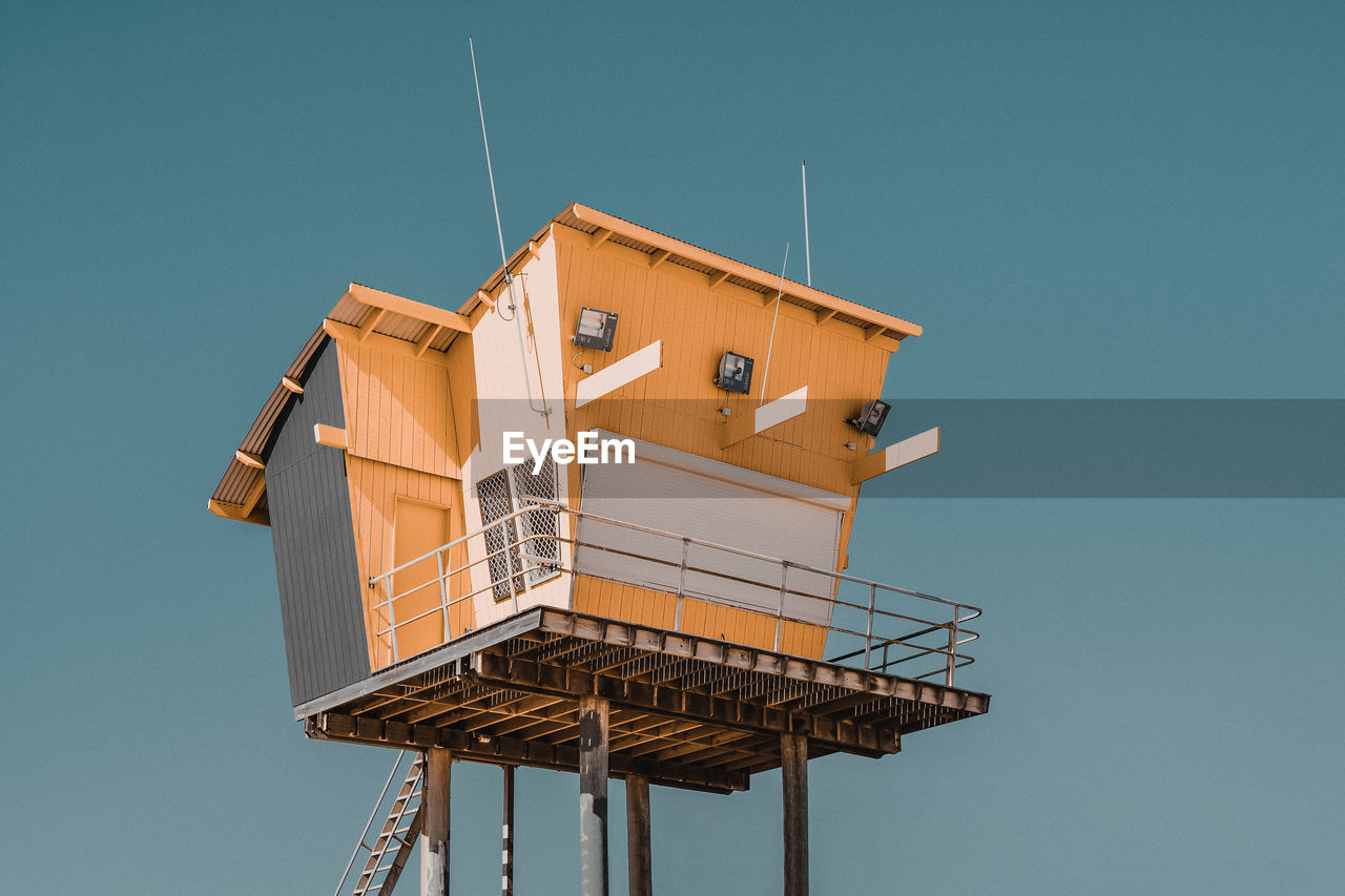 Low angle view of building against blue sky