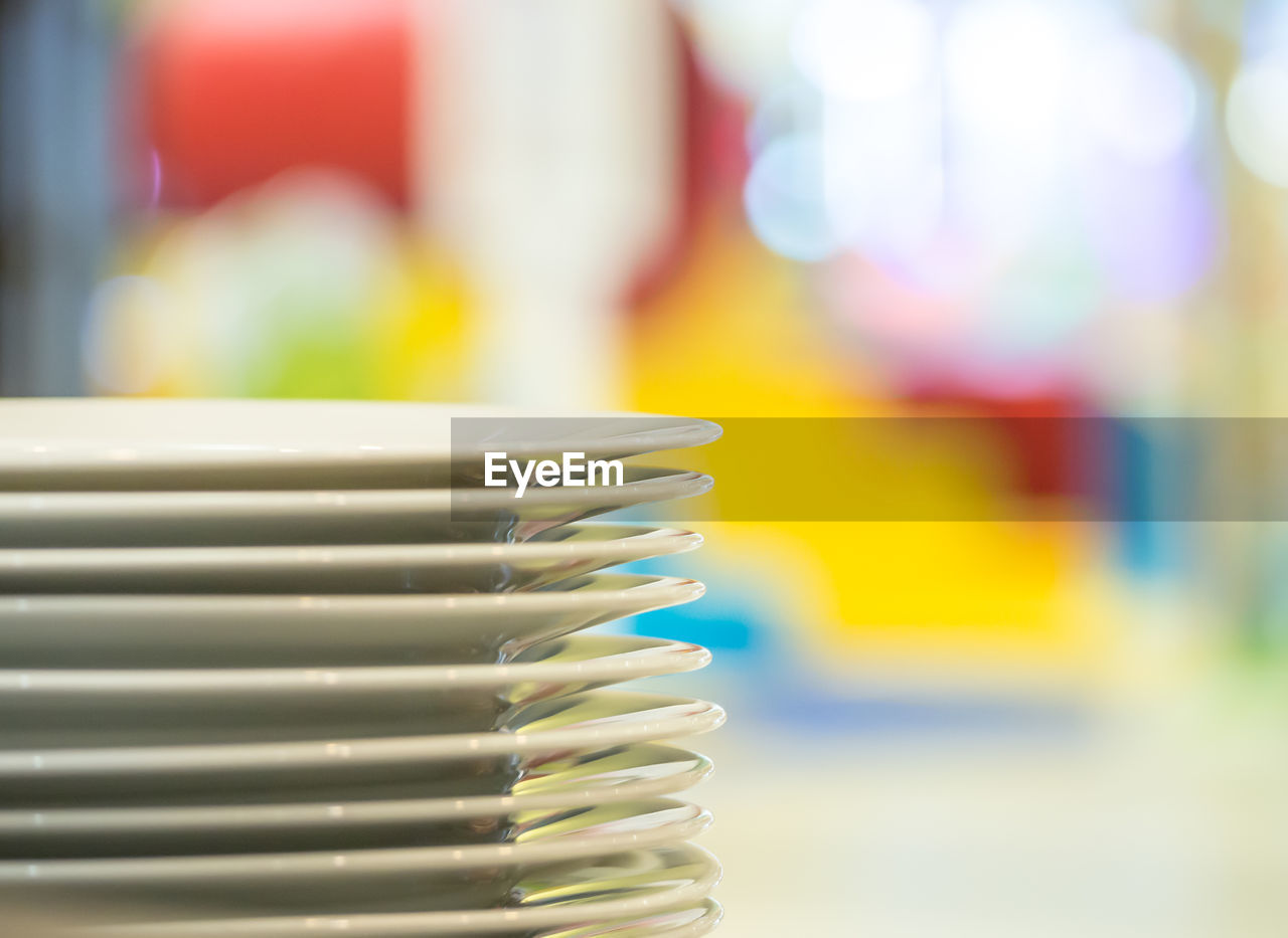 Close-up of stacked empty plates