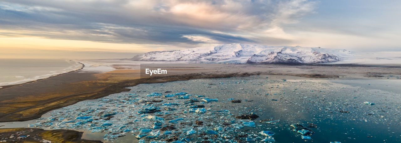 Scenic view of sea against sky during winter