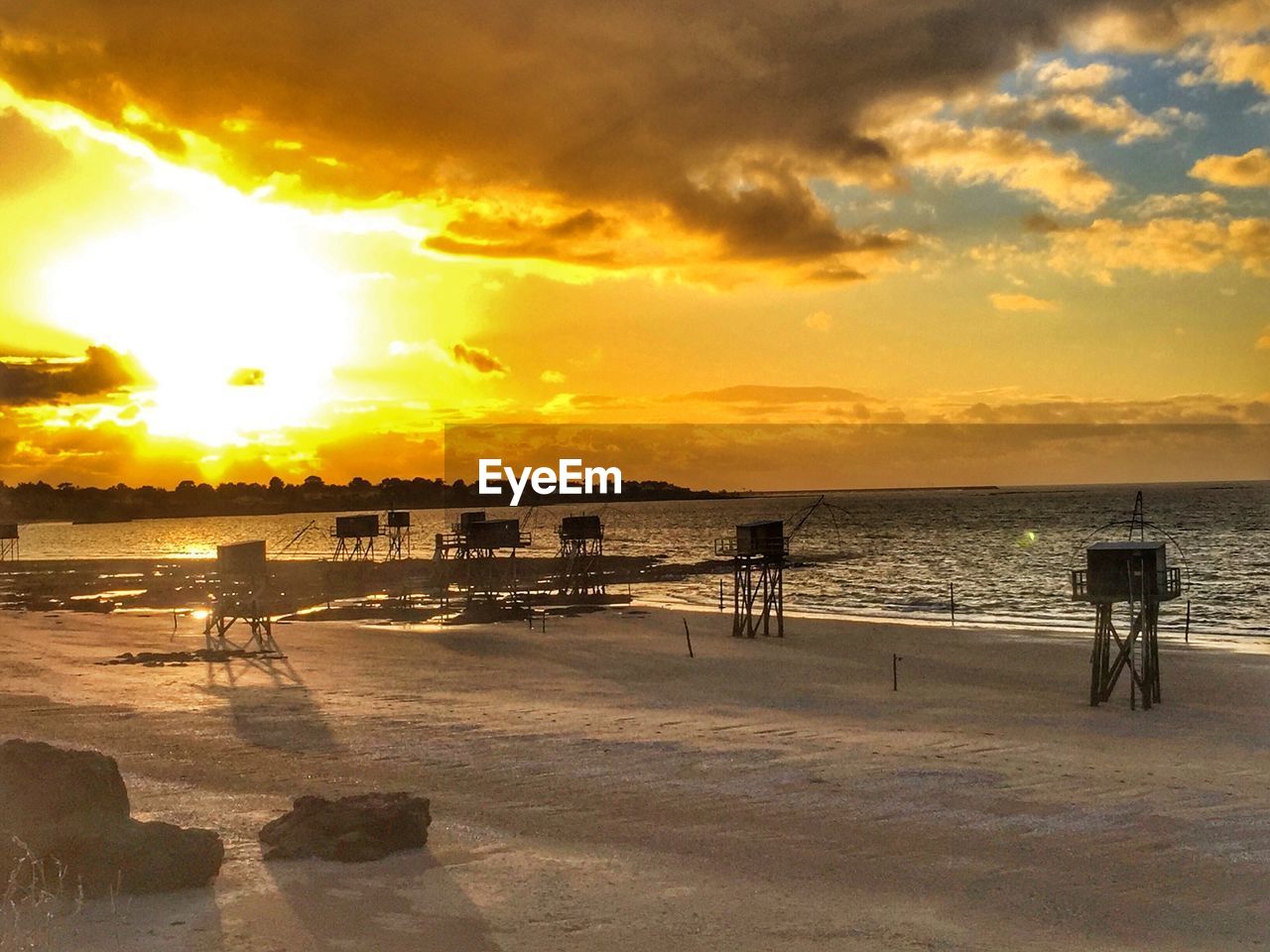 VIEW OF BEACH AGAINST SKY DURING SUNSET