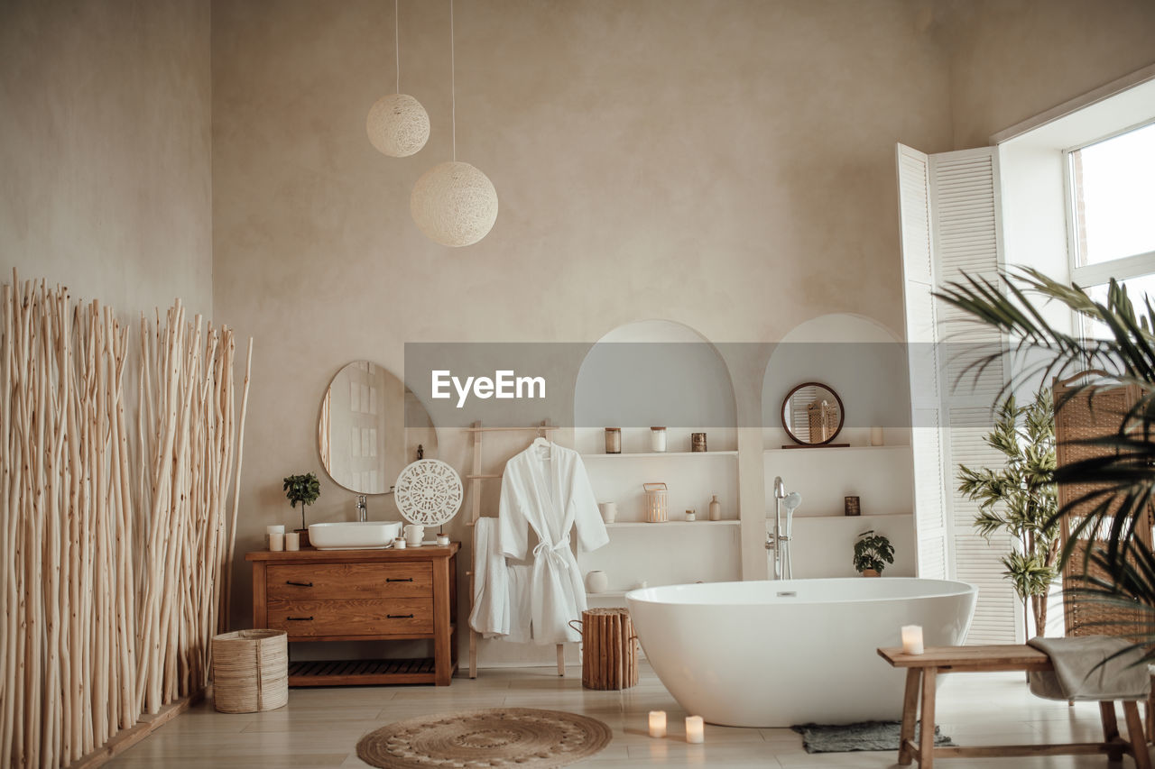 room, indoors, domestic room, home, interior design, home interior, bathroom, luxury, wealth, house, floor, no people, lifestyles, mirror, furniture, bathtub, architecture, home showcase interior, sink, domestic life, estate, domestic bathroom, plumbing fixture, wall, nature, living room, household equipment, seat, flooring, lighting