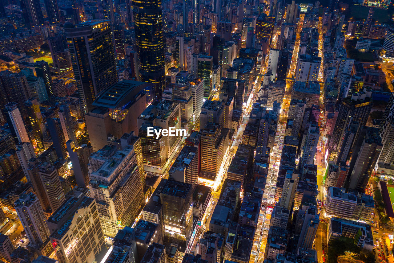 Aerial view of buildings in city at night